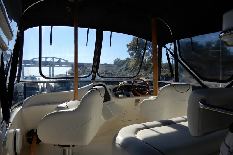 Slide: The Image of Interior view of 2000 Sea Ray 380 Aft Cabin yacht with helm and seating. - 19
