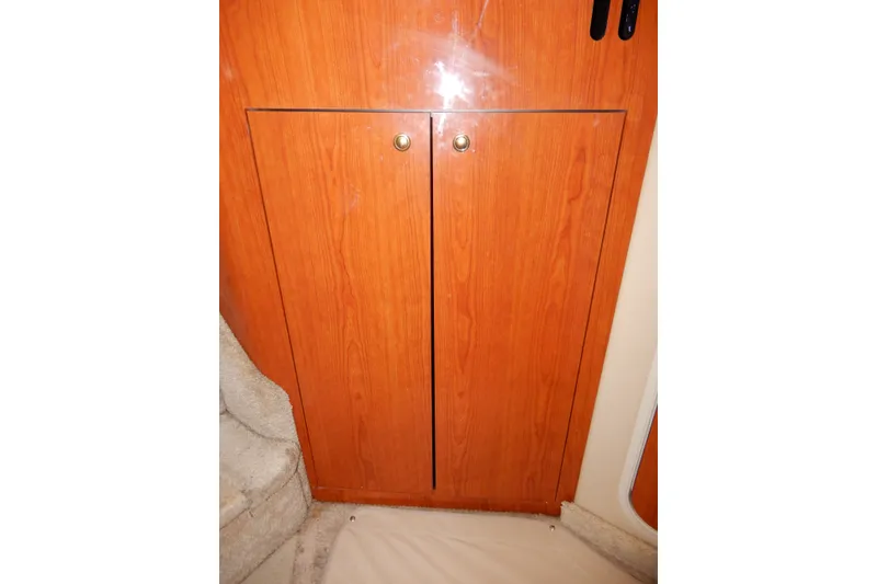 Slide: The Image of Wooden cabinet doors inside a 2000 Sea Ray 380 Aft Cabin yacht. - 54