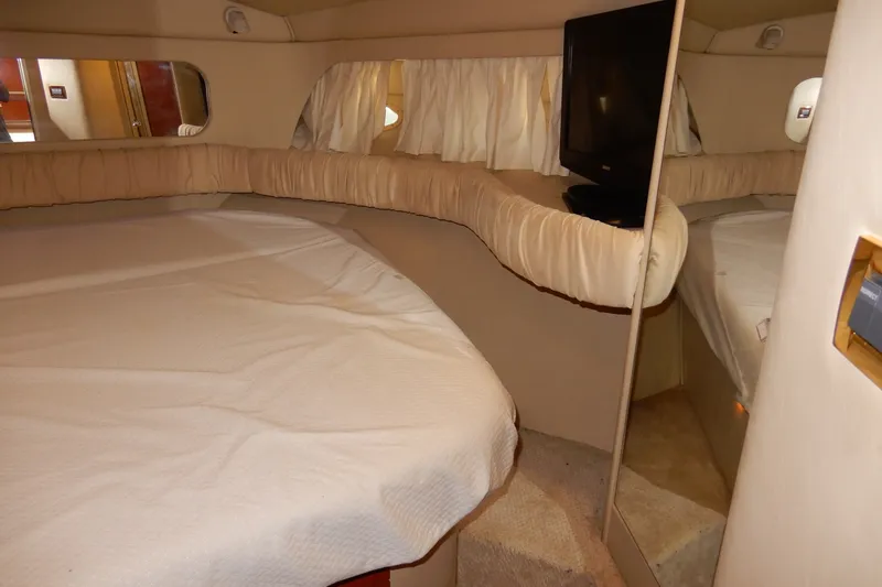 Slide: The Image of Interior cabin of 2000 Sea Ray 380 Aft Cabin yacht with bed and TV. - 62