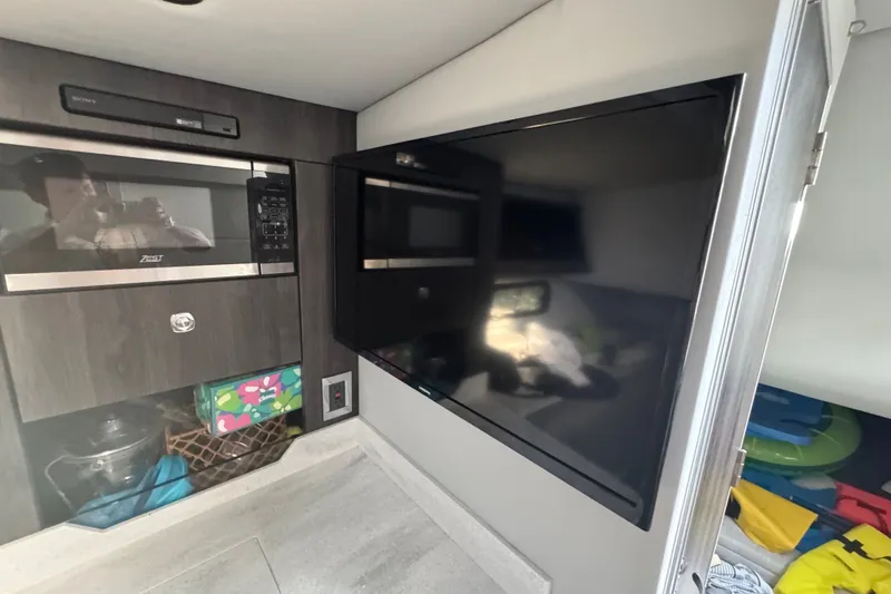 Slide: The Image of Interior of 2022 Formula 400 Super Sport Crossover with TV and microwave. - 36