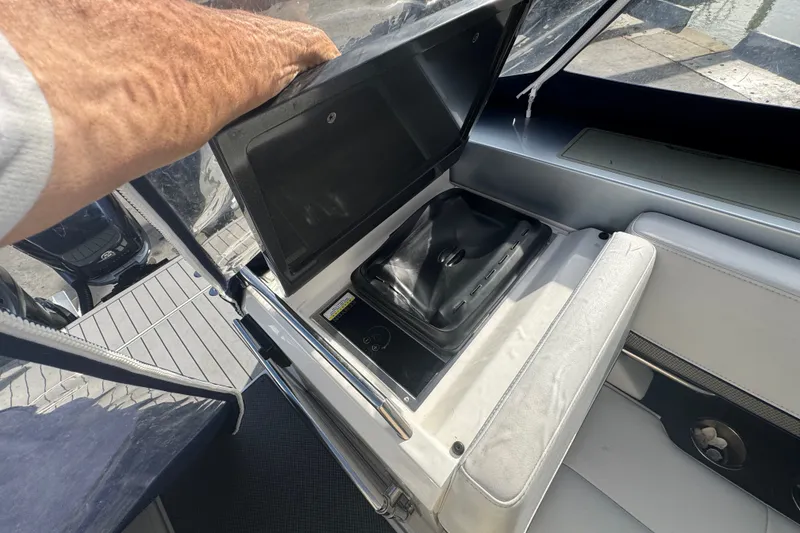 Slide: The Image of 2022 Formula 400 Super Sport Crossover boat interior with open storage compartment. - 21