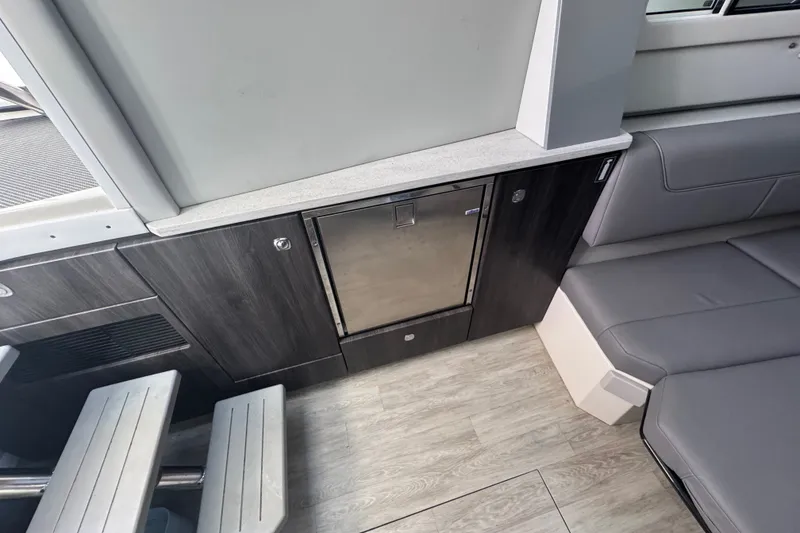 Slide: The Image of Interior of 2022 Formula 400 Super Sport Crossover with sleek seating and modern cabinetry. - 34