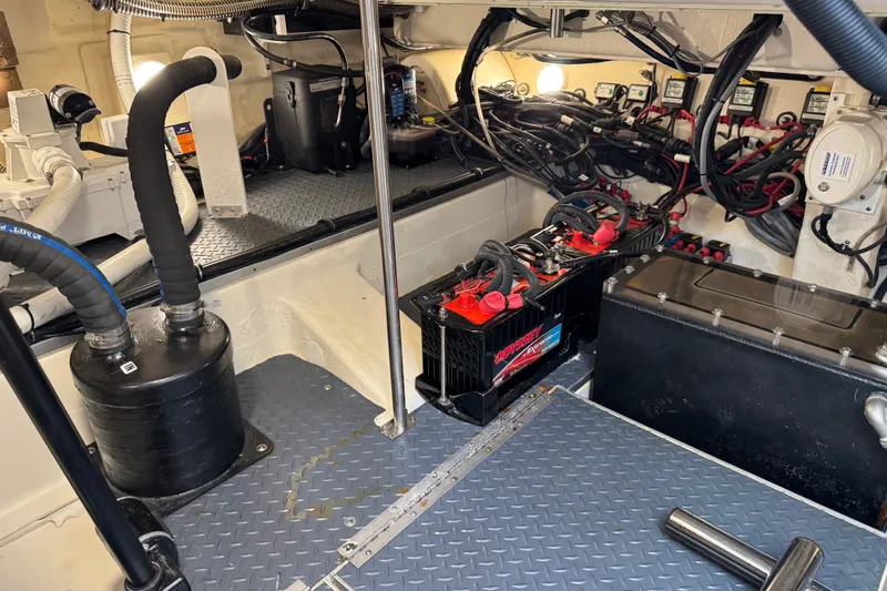 Slide: The Image of Engine room of 2022 Formula 400 Super Sport Crossover with batteries and wiring. - 43