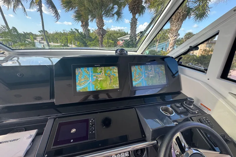Slide: The Image of Dashboard of 2022 Formula 400 Super Sport Crossover with navigation screens and controls. - 30