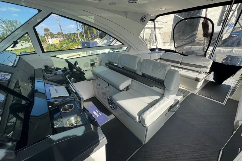 Slide: The Image of Interior of 2022 Formula 400 Super Sport Crossover yacht with luxurious seating and helm. - 29