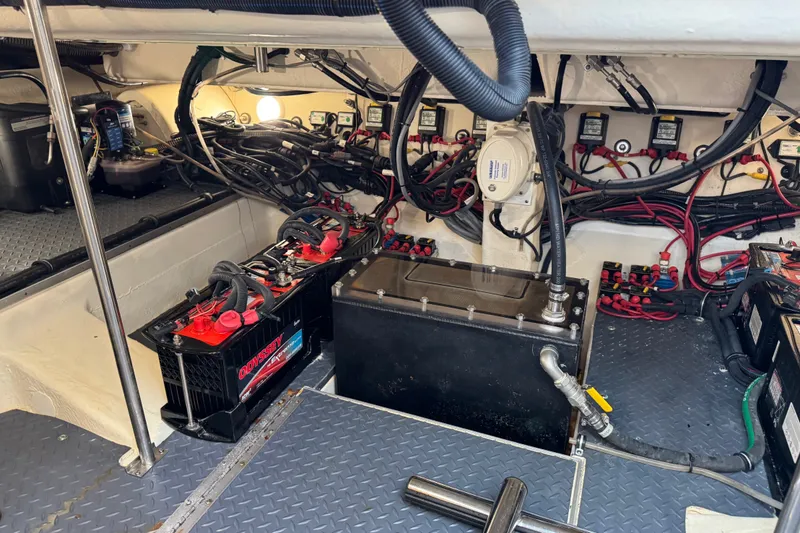 Slide: The Image of Engine compartment of a 2022 Formula 400 Super Sport Crossover with batteries and wiring. - 44