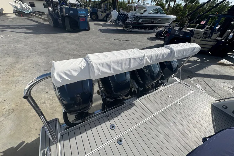 Slide: The Image of 2022 Formula 400 Super Sport Crossover with covered outboard engines on a dock. - 15
