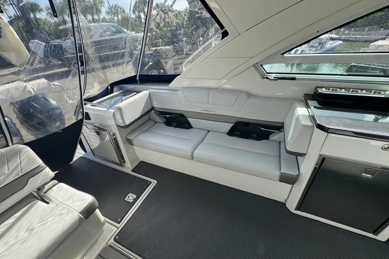 Slide: The Image of Interior of 2022 Formula 400 Super Sport Crossover boat with sleek seating and modern design. - 22
