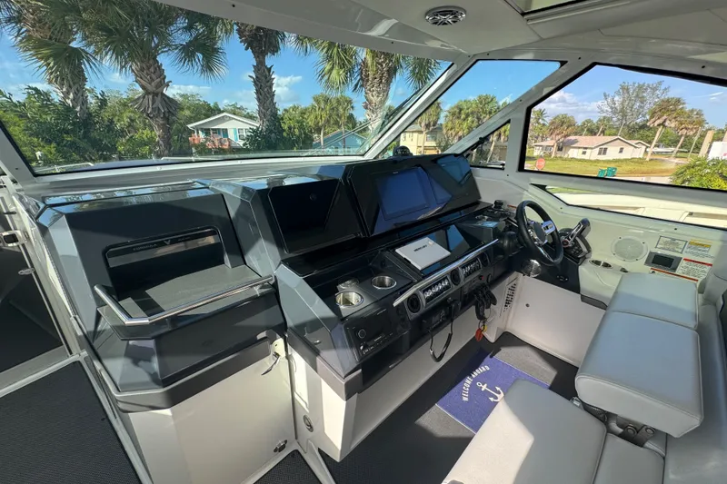 Slide: The Image of Interior cockpit of 2022 Formula 400 Super Sport Crossover boat with modern controls and seating. - 28