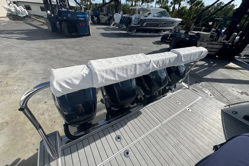 Slide: The Image of 2022 Formula 400 Super Sport Crossover with covered outboard engines on a dock. - 14