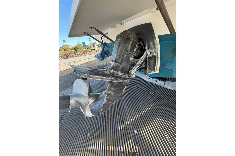 Slide: The Image of Close-up of a 2001 Austin Parker 2510DV boat propeller and stern on a trailer. - 30