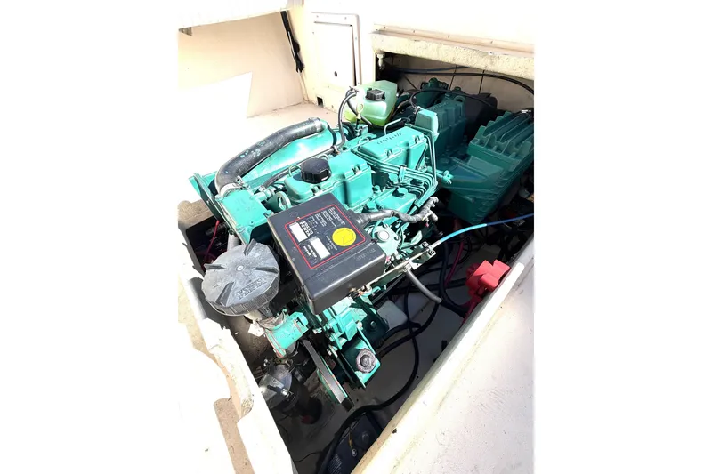 Slide: The Image of Engine compartment of a 2001 Austin Parker 2510DV boat, showcasing mechanical components. - 7