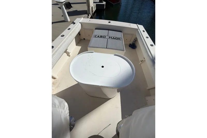 Slide: The Image of 2001 Austin Parker 2510DV boat deck with seating and storage, docked at marina. - 14