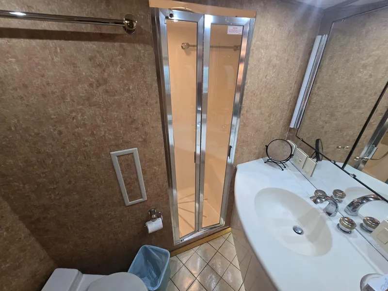 Slide: The Image of Bathroom interior of 1994 Hatteras 82 Convertible yacht with shower and sink. - 30
