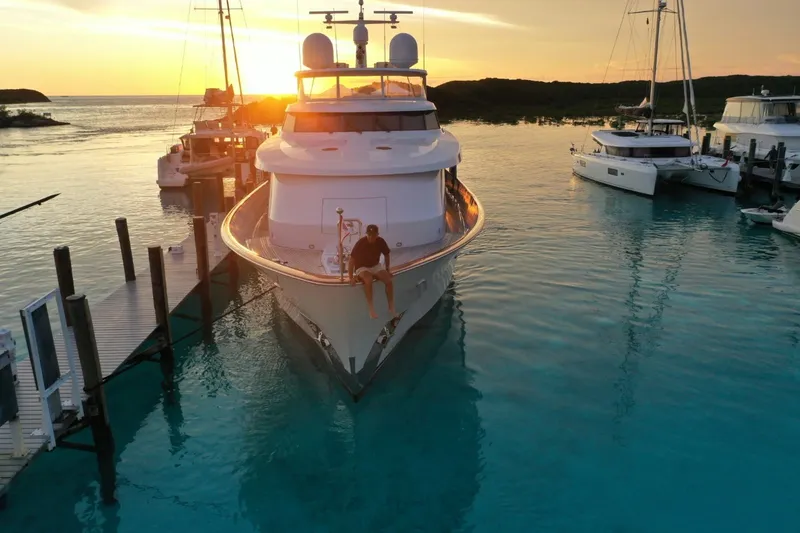 Slide: The Image of Delta Marine 110 Raised Pilothouse yacht docked at sunset, 1994 model. - 16
