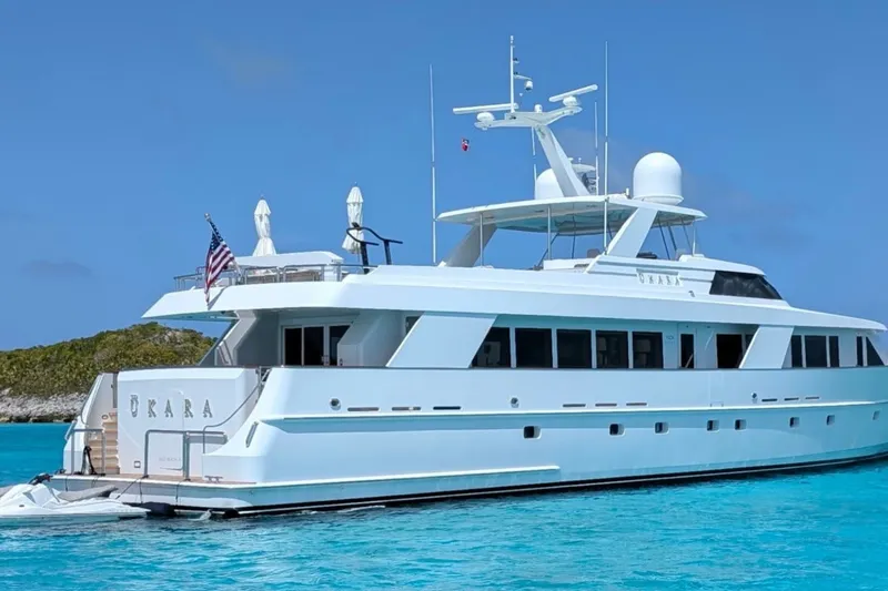 Slide: The Image of Luxury yacht Delta Marine 110 Raised Pilothouse, 1994, anchored in clear blue waters. - 7
