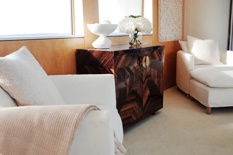 Slide: The Image of Luxurious yacht interior with elegant seating, decorative cabinet, and floral arrangement, Delta Marine 110 Raised Pilothouse. - 34