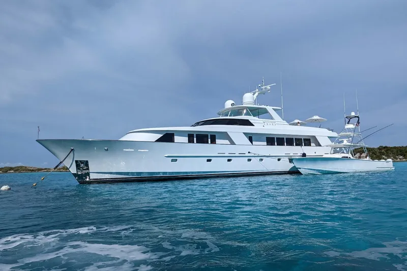 Slide: The Image of Delta Marine 110 Raised Pilothouse yacht, 1994 model, anchored in clear blue waters. - 8