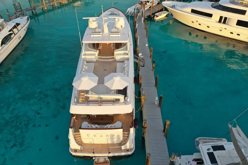 Slide: The Image of Aerial view of 1994 Delta Marine 110 Raised Pilothouse yacht docked in clear turquoise water. - 19