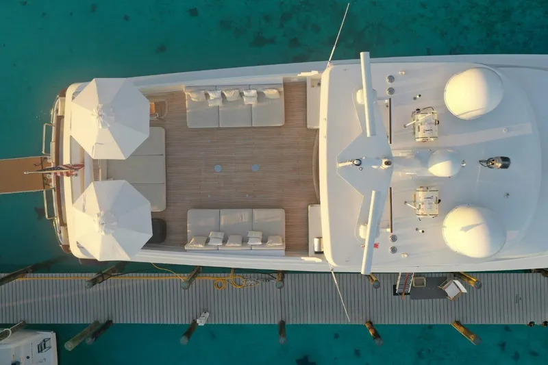 Slide: The Image of Aerial view of 1994 Delta Marine 110 Raised Pilothouse yacht docked in clear turquoise water. - 20