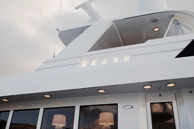Slide: The Image of Delta Marine 110 Raised Pilothouse yacht, 1994 model, exterior view with illuminated name. - 25