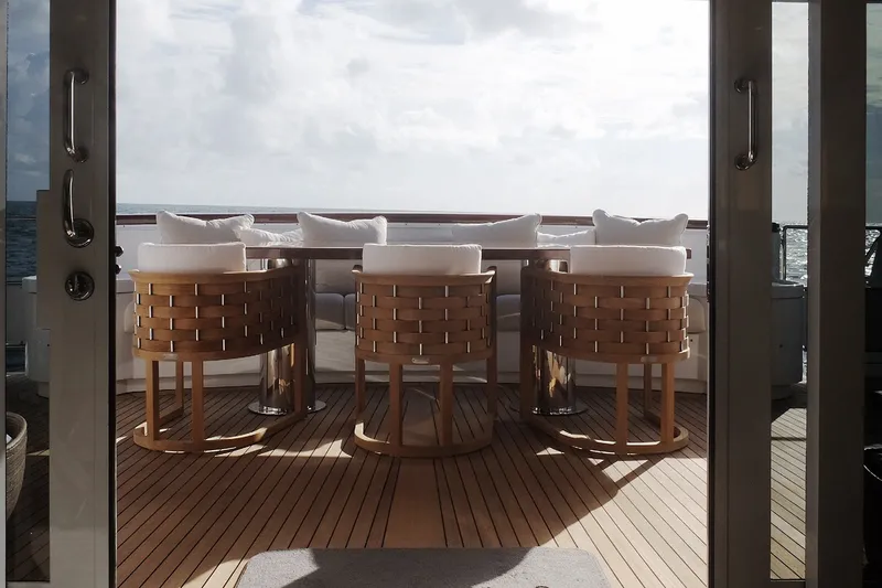 Slide: The Image of Luxurious yacht deck with elegant wicker chairs and ocean view, Delta Marine 110 Raised Pilothouse, 1994. - 26