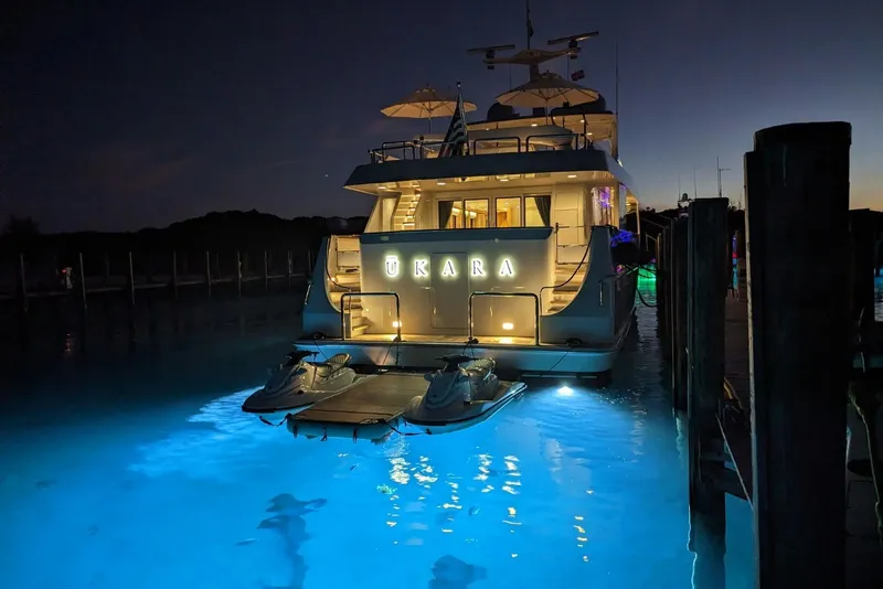 Slide: The Image of Luxurious 1994 Delta Marine 110 Raised Pilothouse yacht illuminated at night in marina. - 15