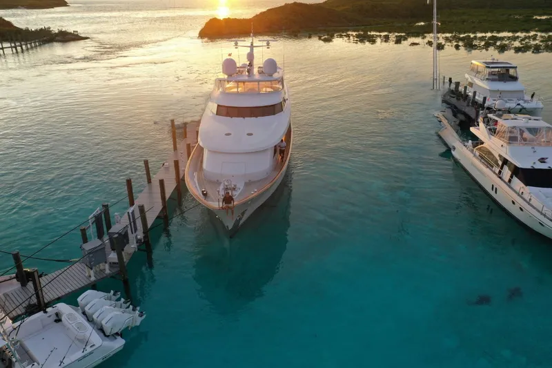 Slide: The Image of Delta Marine 110 Raised Pilothouse yacht docked at sunset, 1994 model. - 18