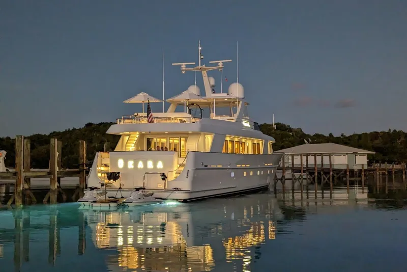 Slide: The Image of Luxurious 1994 Delta Marine 110 Raised Pilothouse yacht docked at sunset. - 11