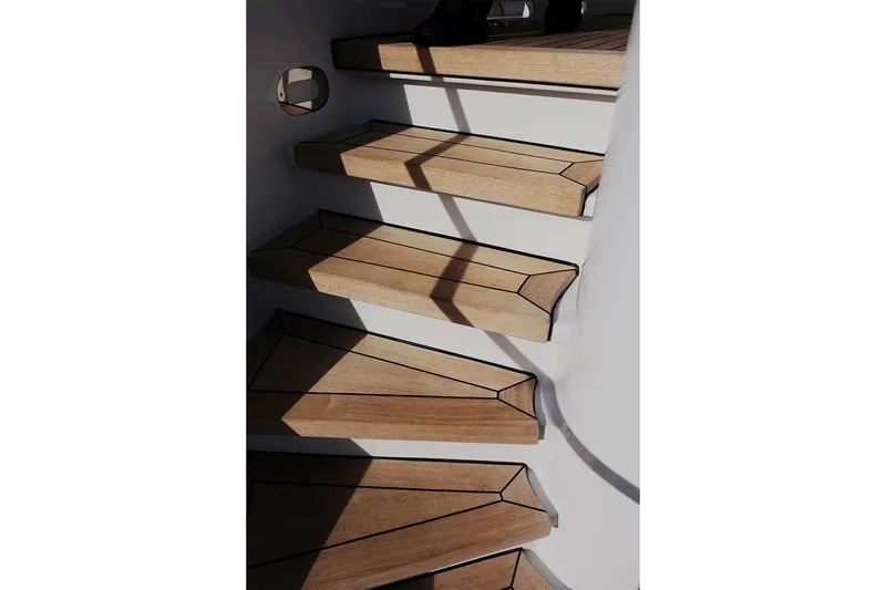Slide: The Image of Wooden stairs on a 1994 Delta Marine 110 Raised Pilothouse yacht. - 37