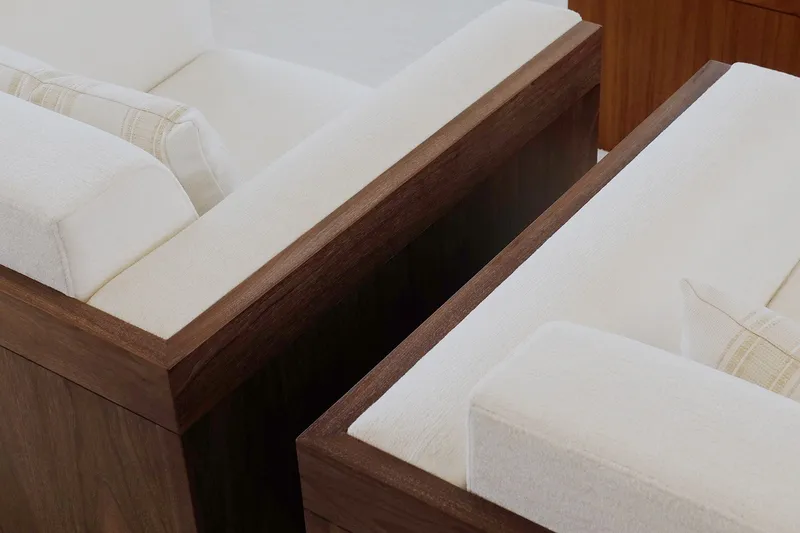 Slide: The Image of Luxurious white seating with wooden frames on Delta Marine 110 Raised Pilothouse, 1994 model. - 28