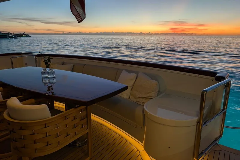 Slide: The Image of Luxurious Delta Marine 110 yacht deck at sunset, featuring elegant seating and ocean views. - 13