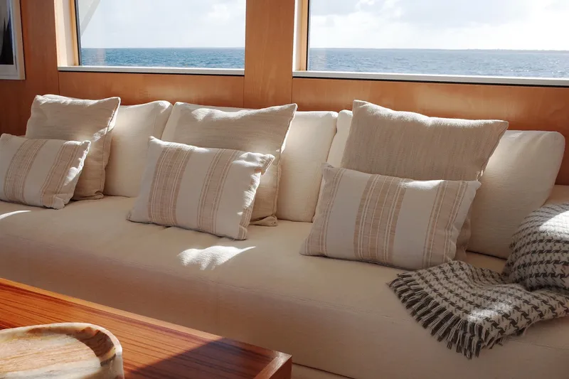 Slide: The Image of Luxurious interior of 1994 Delta Marine 110 yacht with cozy cushions and ocean view. - 29