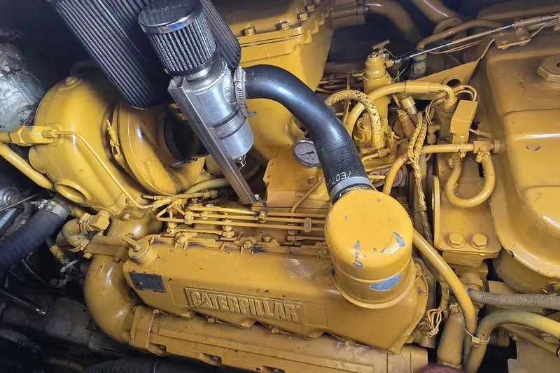 Slide: The Image of Caterpillar engine in a 1994 Sunseeker Mustique 42 yacht, showcasing detailed components. - 35