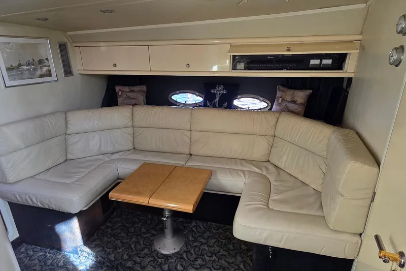 Slide: The Image of Luxurious interior of 1994 Sunseeker Mustique 42 yacht with cream leather seating. - 16
