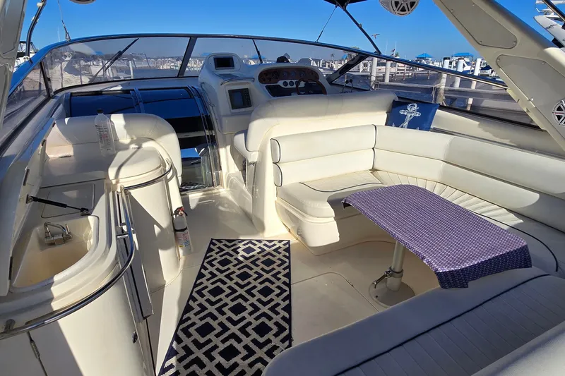 Slide: The Image of Luxurious interior of 1994 Sunseeker Mustique 42 yacht with white seating and nautical decor. - 6