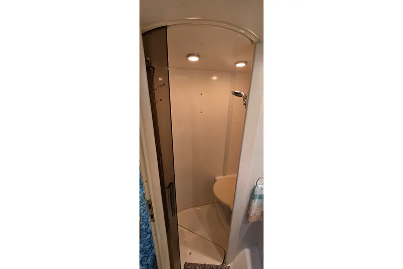 Slide: The Image of Shower area in 1994 Sunseeker Mustique 42 yacht, featuring modern lighting and fixtures. - 22