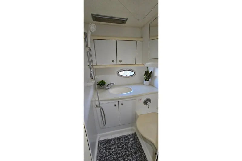 Slide: The Image of Bathroom interior of 1994 Sunseeker Mustique 42 yacht, featuring sink and storage cabinets. - 26