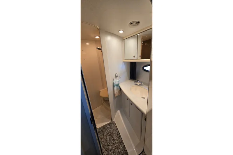 Slide: The Image of Bathroom interior of 1994 Sunseeker Mustique 42 yacht, featuring sink and storage cabinets. - 23
