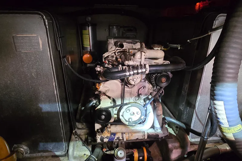 Slide: The Image of Engine compartment of a 1994 Sunseeker Mustique 42 yacht, showcasing mechanical components. - 33