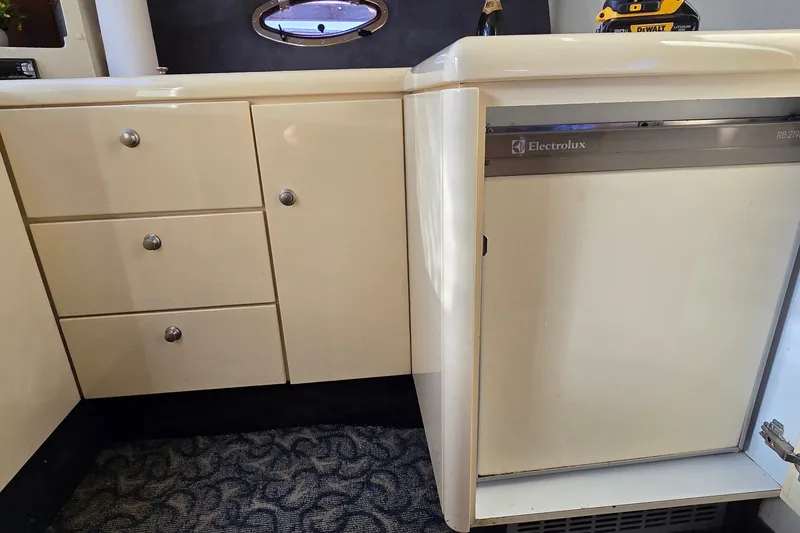 Slide: The Image of Interior of 1994 Sunseeker Mustique 42 yacht with Electrolux fridge and cabinetry. - 31
