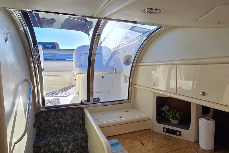 Slide: The Image of Interior view of 1994 Sunseeker Mustique 42 yacht, featuring seating and cabinetry. - 27