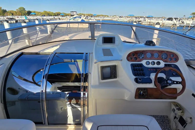 Slide: The Image of Cockpit view of 1994 Sunseeker Mustique 42 yacht at marina. - 8