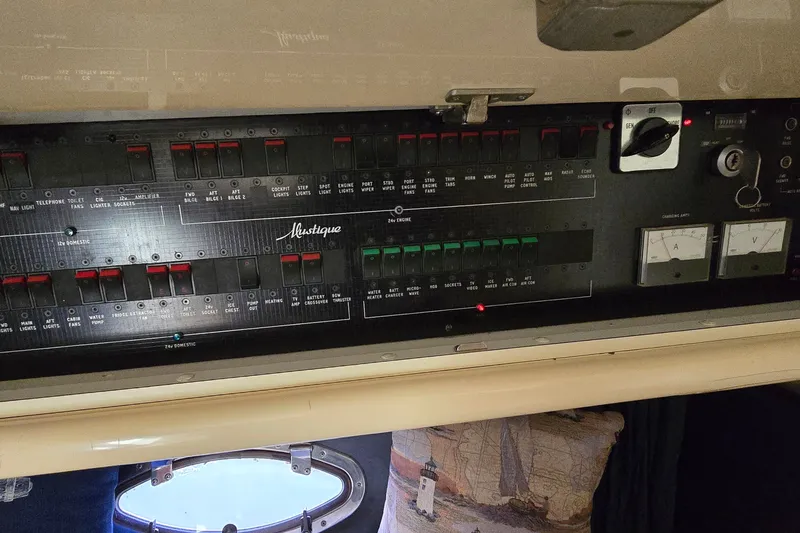 Slide: The Image of Control panel of a 1994 Sunseeker Mustique 42 yacht with switches and gauges. - 30