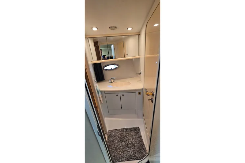Slide: The Image of Bathroom interior of 1994 Sunseeker Mustique 42 yacht, featuring sink and mirror. - 21