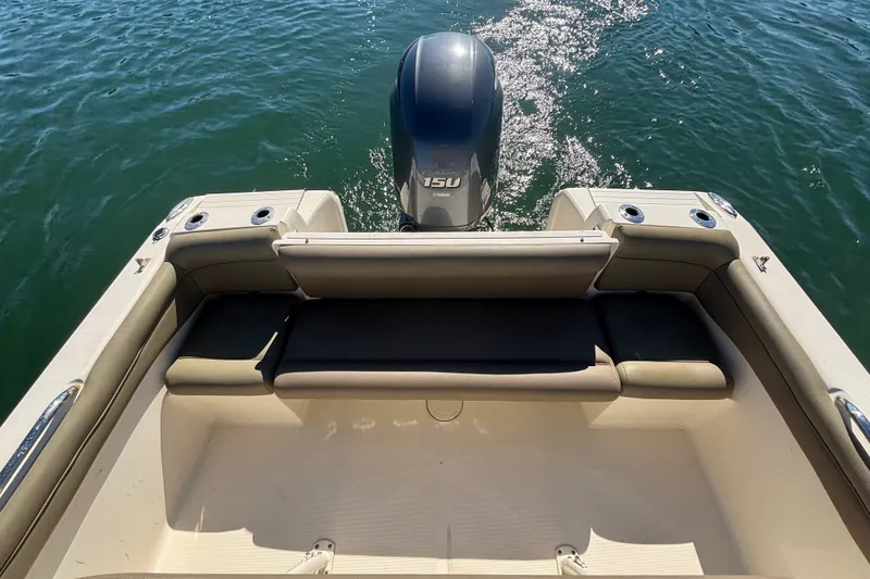 Slide: The Image of 2016 Scout 210 XSF boat with Yamaha outboard motor on water. - 13