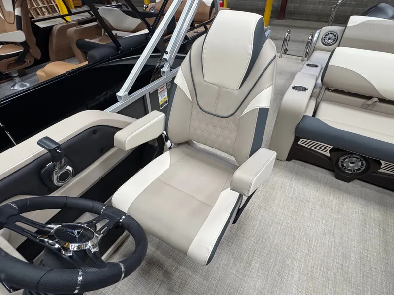 Slide: The Image of Luxurious captain's chair with sleek stitching and armrests, surrounded by stylish interior features. - 7
