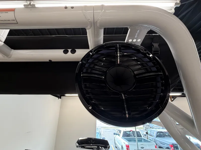Slide: The Image of Close-up of a black speaker mounted on a white boat frame. - 19