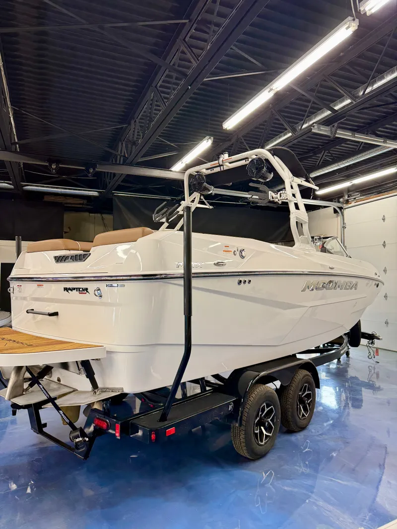 Slide: The Image of A 2026 Moomba Max boat is on a trailer inside a warehouse. - 20