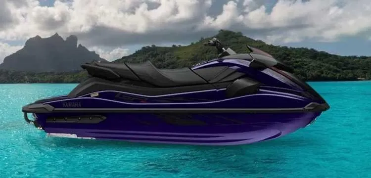 The Image of A 2027 Yamaha WaveRunner GP SVHO floats on turquoise water with a tropical island in the background. - 1